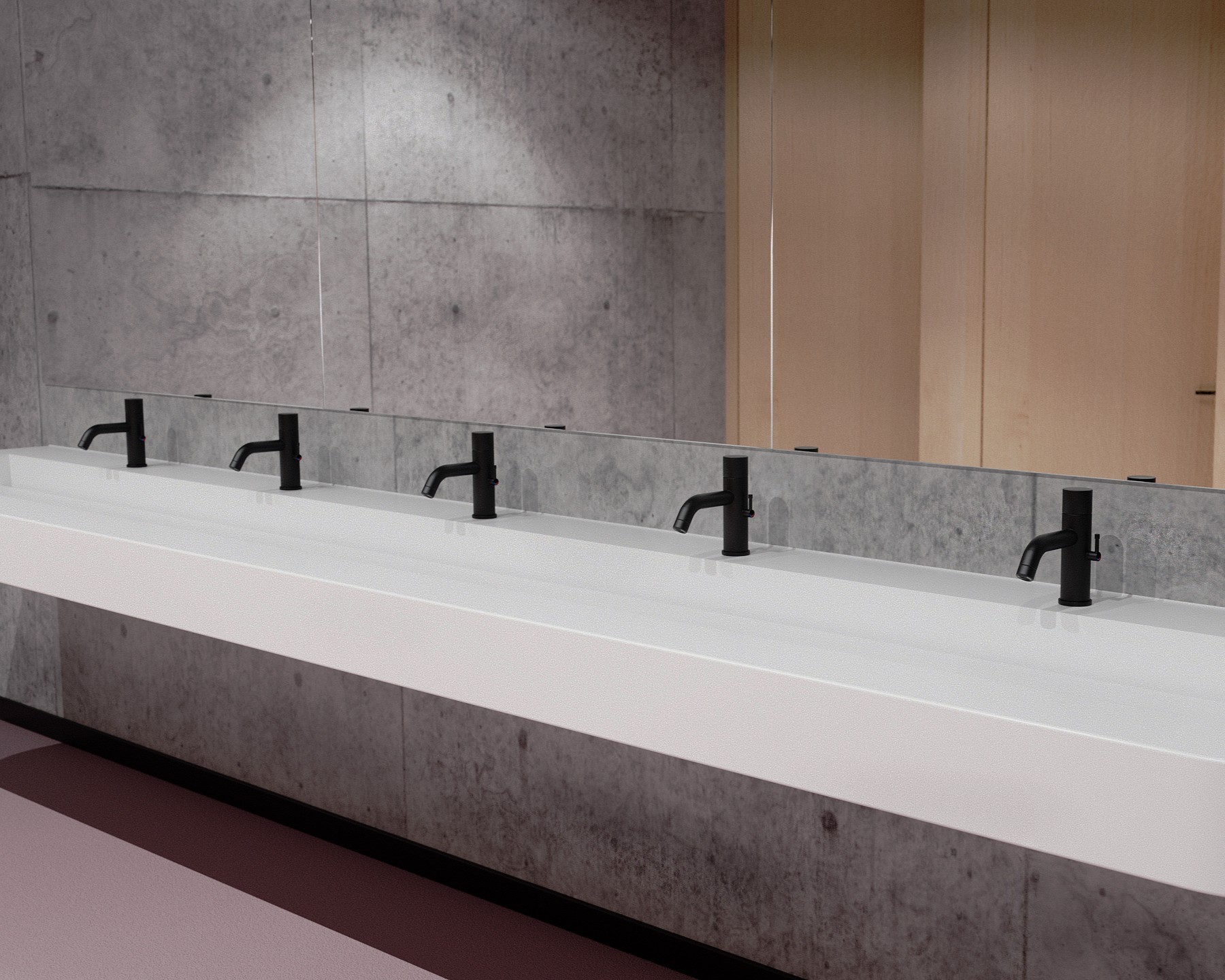Contemporary commercial washroom featuring Duten R311 deck-mounted electronic taps in KOVETA matte black finish.